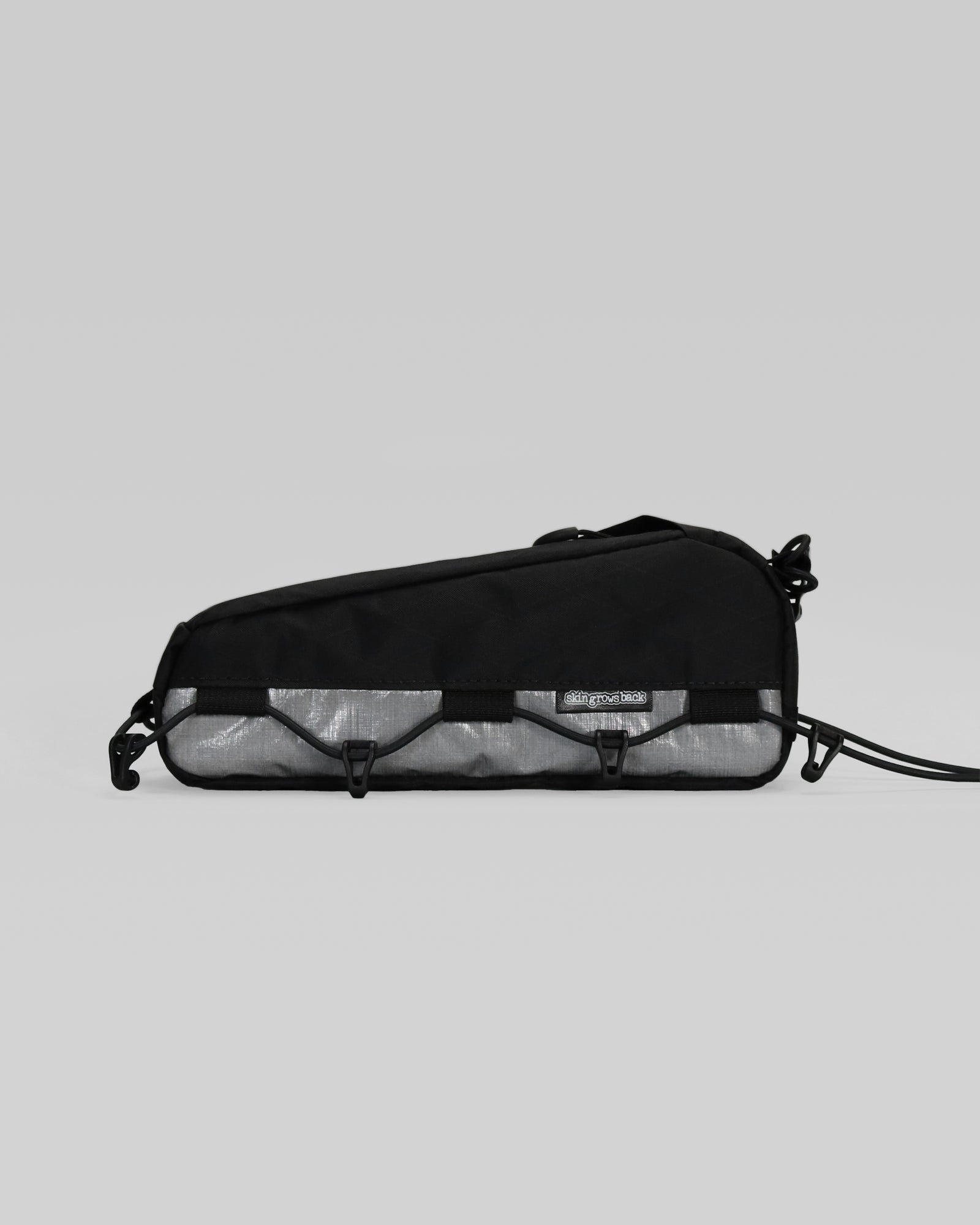 Skingrowsback transcend racing series hot dog racing top tube bag dyneema against a grey background