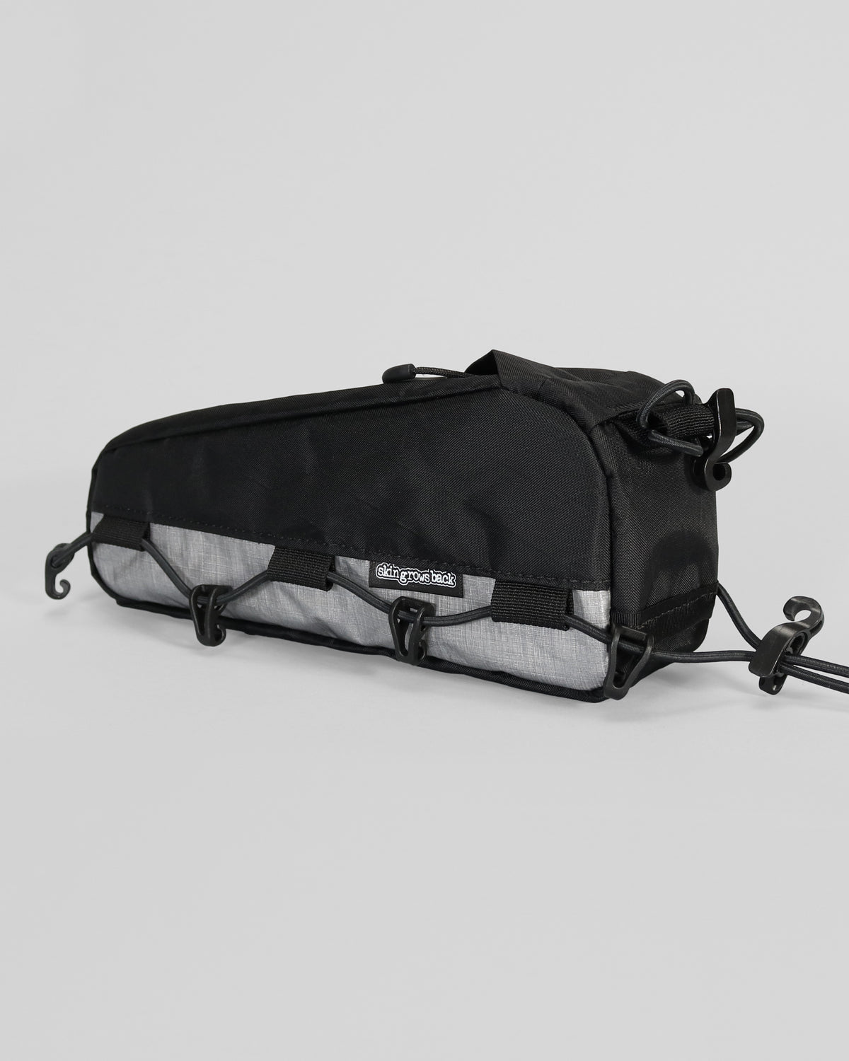 Skingrowsback transcend racing series hot dog racing top tube bag dyneema against a grey background