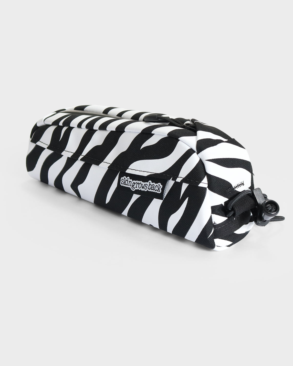skingrowsback Hot Dog bolt on top tube bag black and white zebra print with a white background