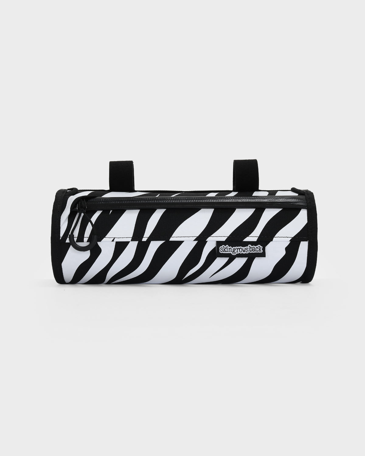 skingrowsback little lunch handlebar bag black and white zebra print with a white background