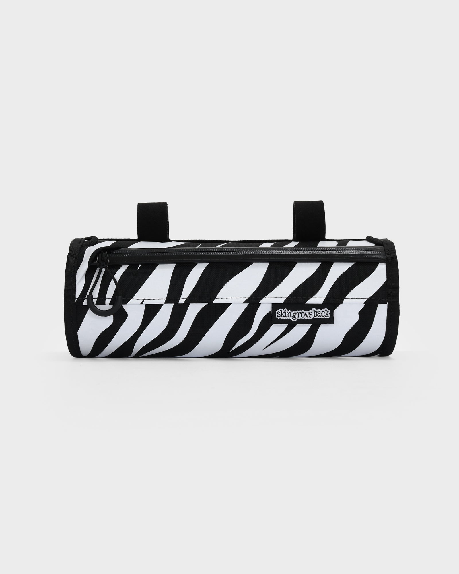 skingrowsback little lunch handlebar bag black and white zebra print with a white background