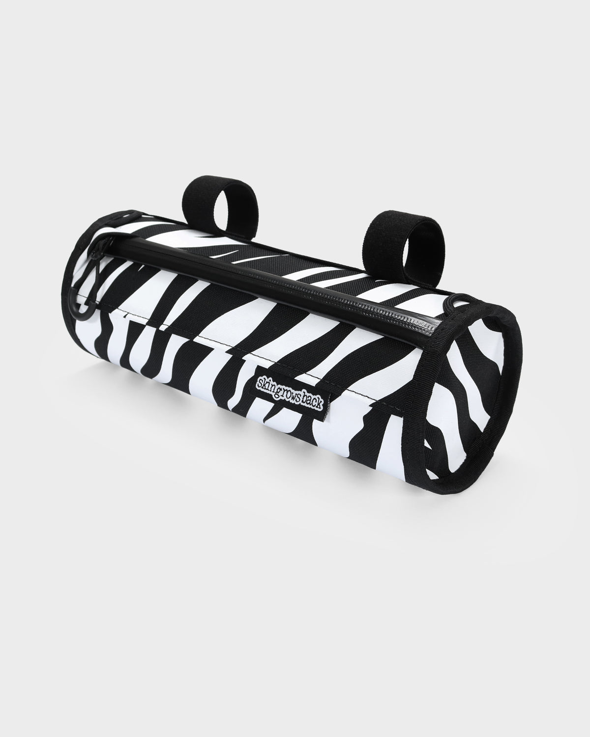 skingrowsback little lunch handlebar bag black and white zebra print with a white background