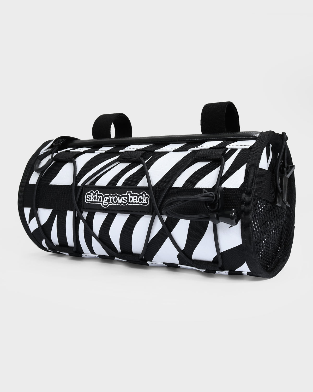 skingrowsback lunchbox handlebar bag black and white zebra print with a white background