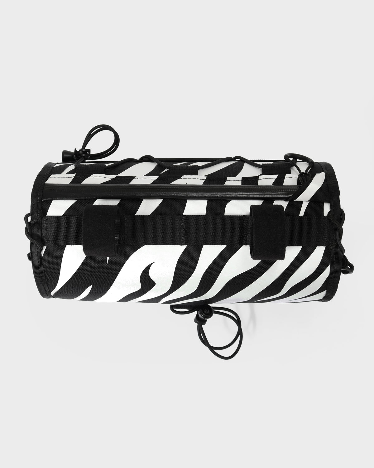skingrowsback lunchbox handlebar bag black and white zebra print with a white background