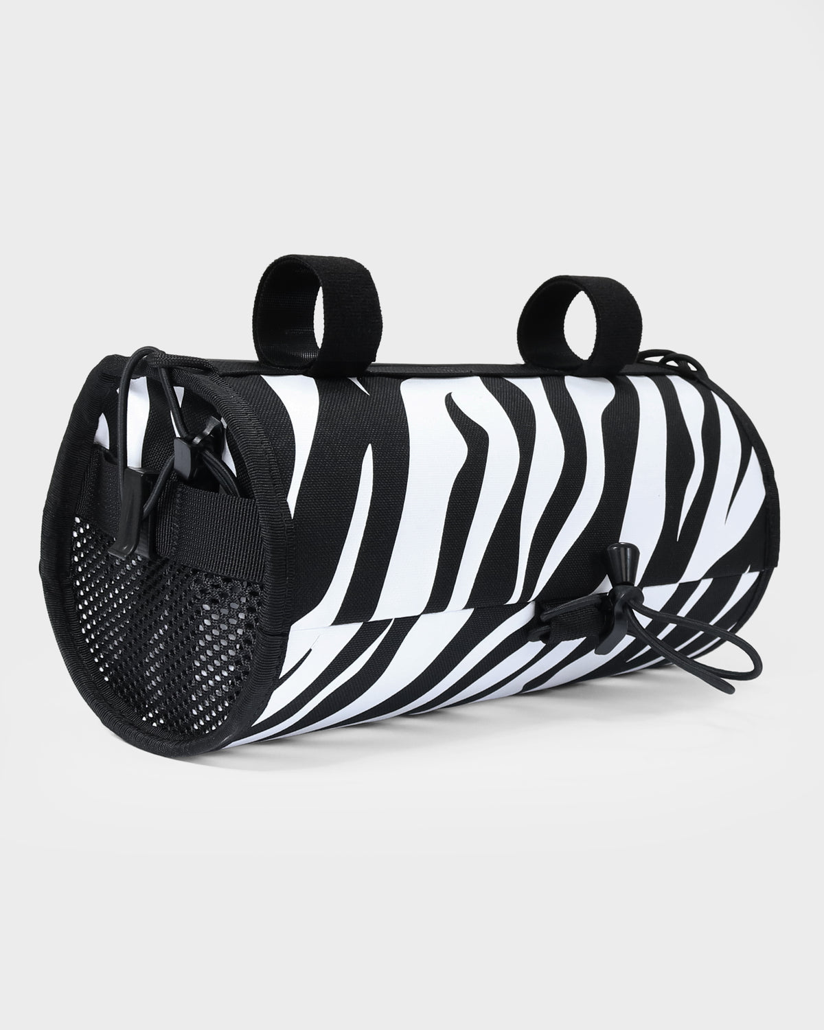 skingrowsback lunchbox handlebar bag black and white zebra print with a white background