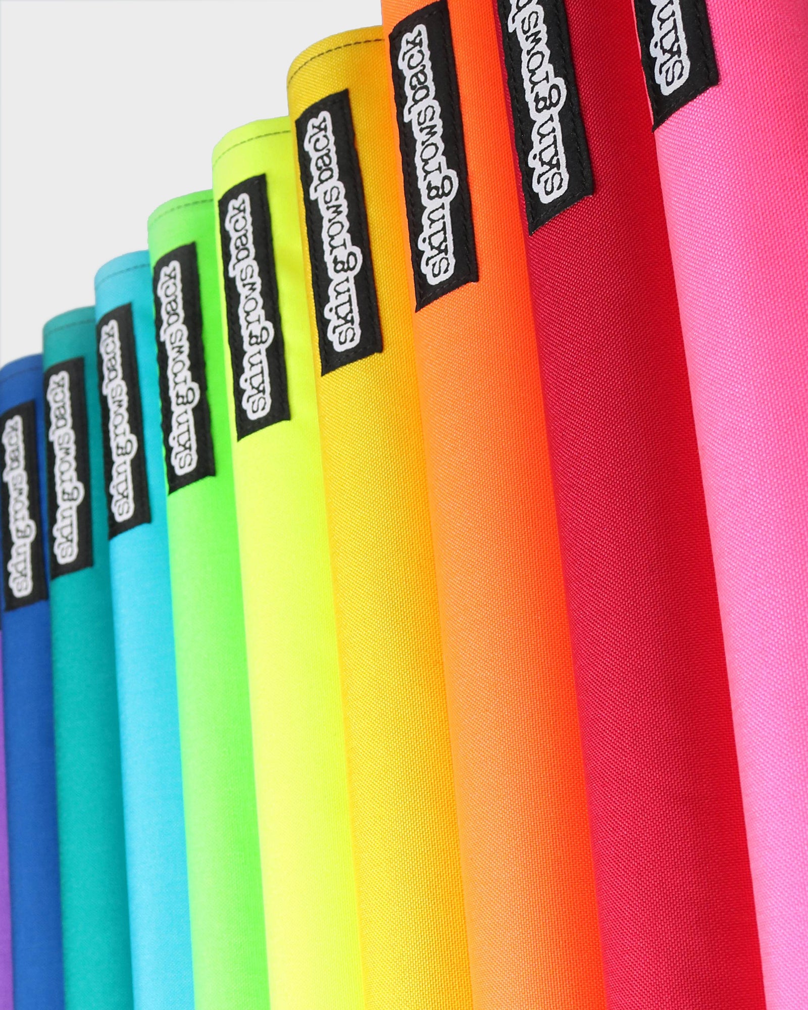 Skingrowsback fixed gear top tube pads rainbow colours on a white background