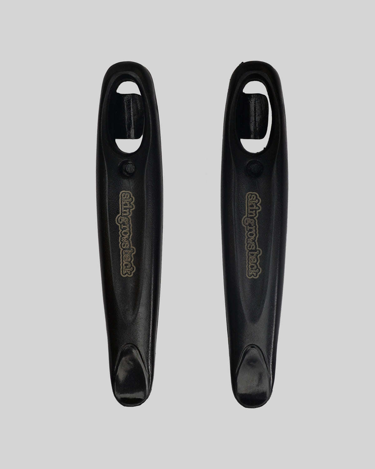 skingrowsback tyre black levers pair on grey background