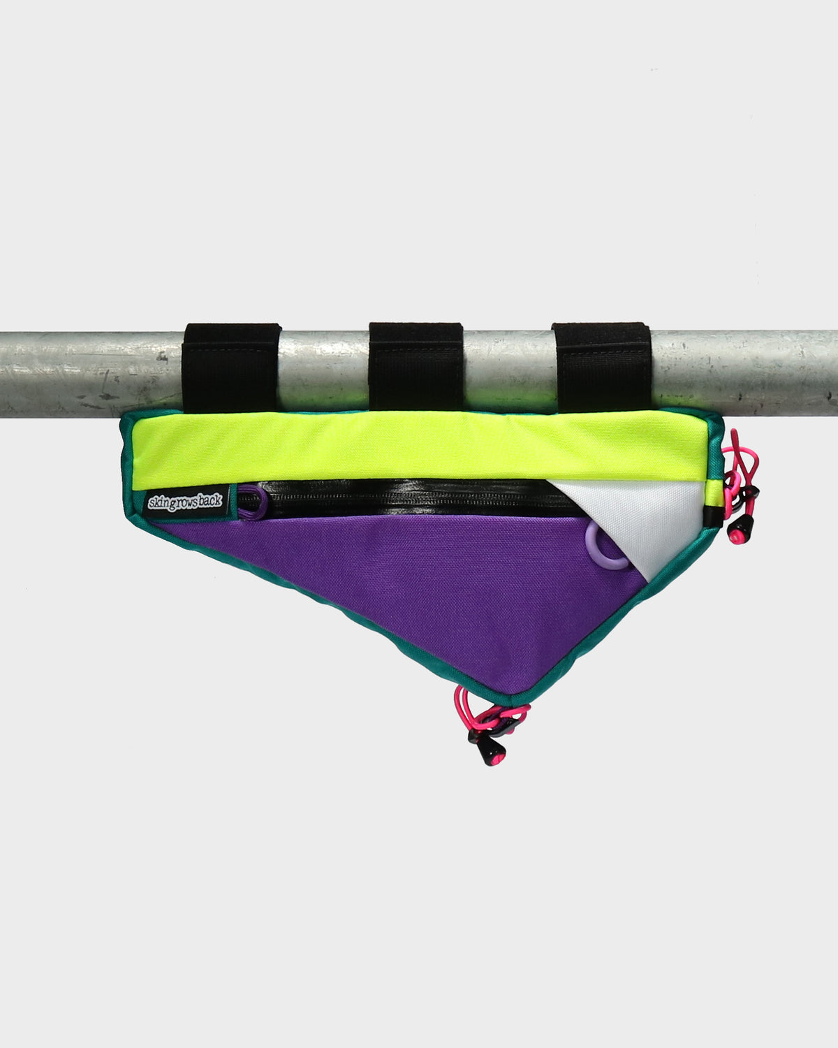 Skingrowsback wedge frame bag turbo collection mounted to a scaffold pole against a white background
