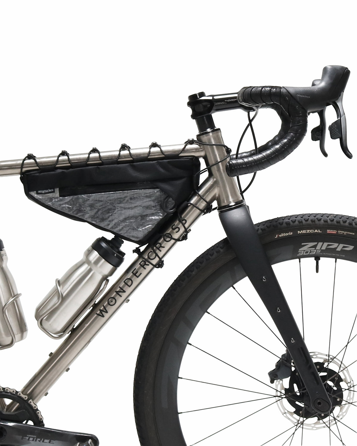 Skingrowsback Wedge Racing frame bag black xpac vx21 silver dyneema on a titanium gravel bike on a white background