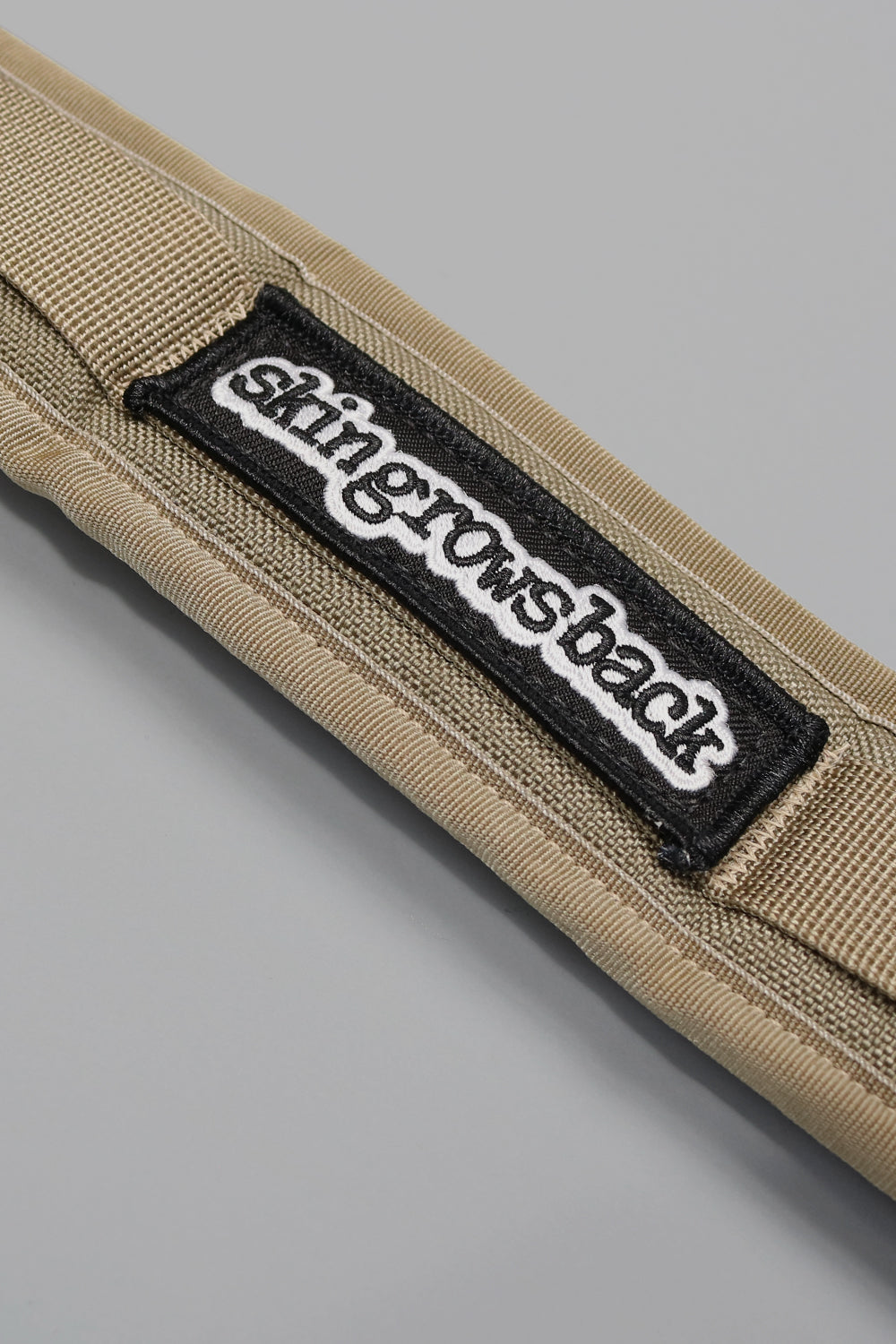 skingrowsback 3point cycling camera strap manufactured in australia stone