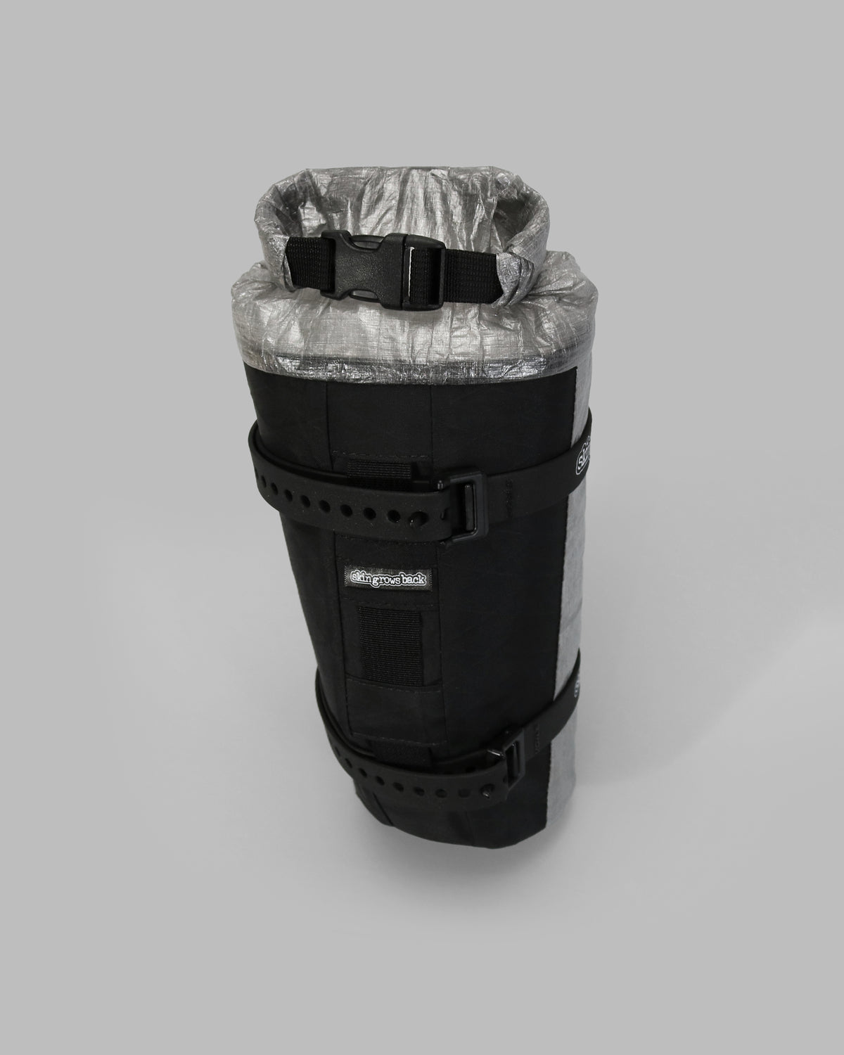 Skingrowsback transcend racing series moai bikepacking fork bag black xpac vx21 with silver dyneema against a grey background