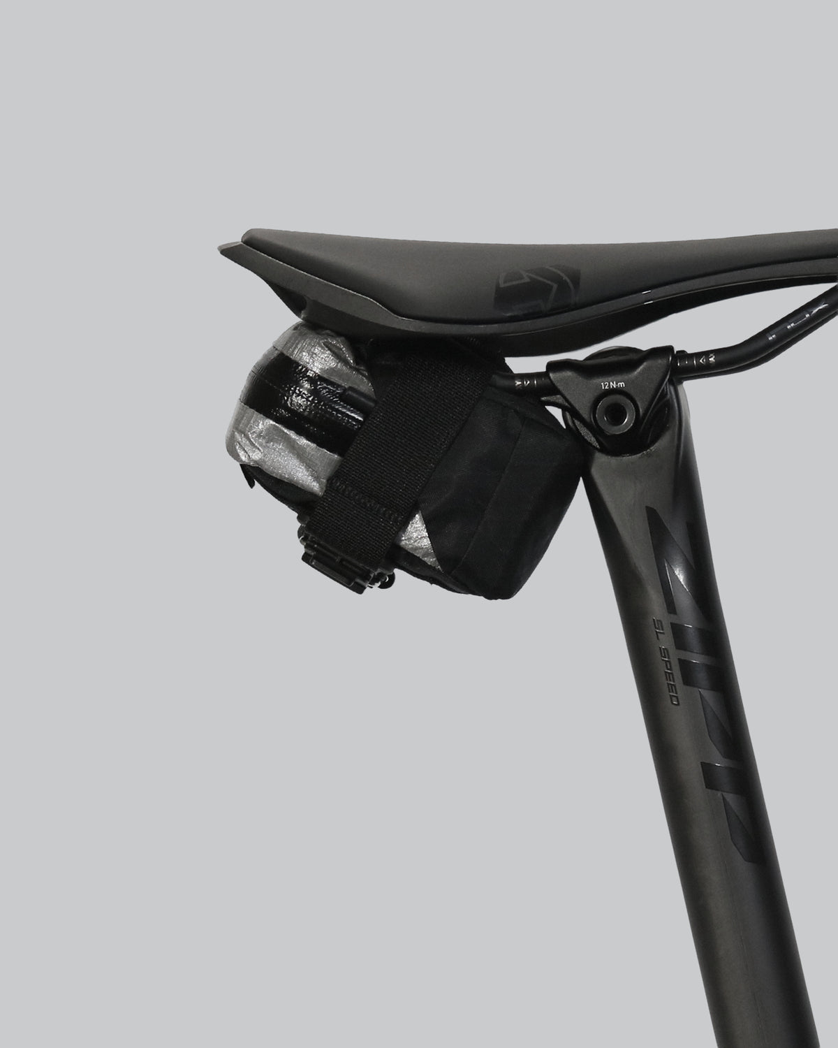 skingrowsback plan b micron racing saddle bag black xpac vx21 plus reflective dyneema on a black bike seat