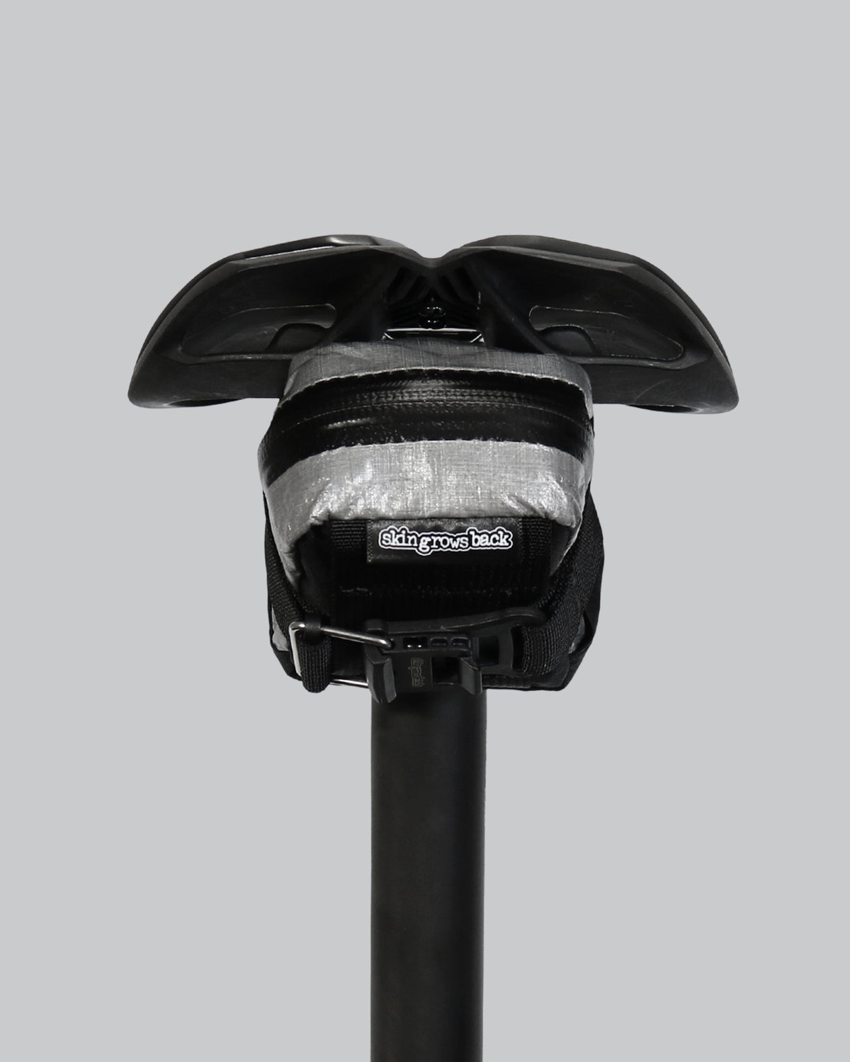skingrowsback plan b micron racing saddle bag black xpac vx21 plus reflective dyneema on a black bike seat