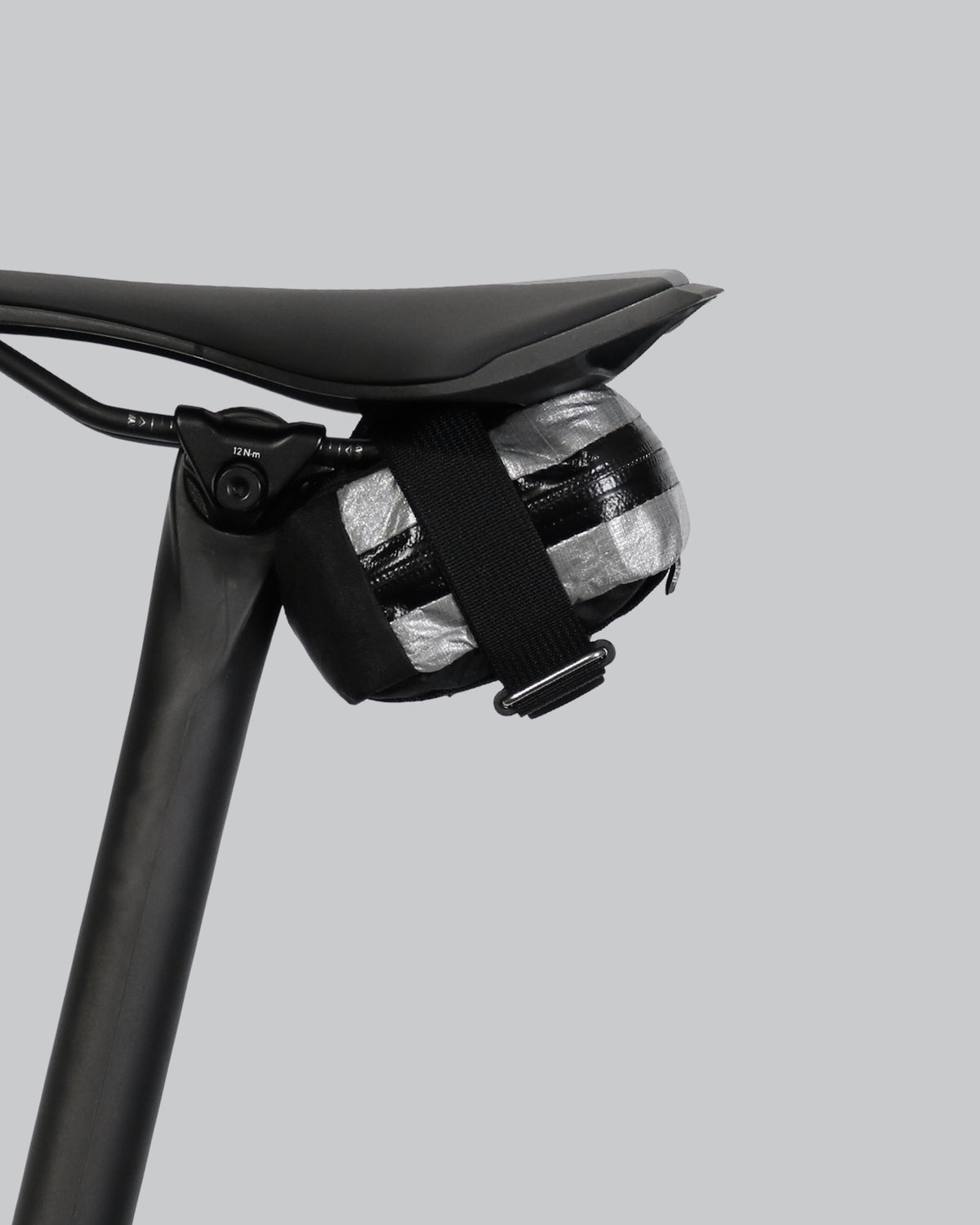 skingrowsback plan b micron racing saddle bag black xpac vx21 plus reflective dyneema on a black bike seat