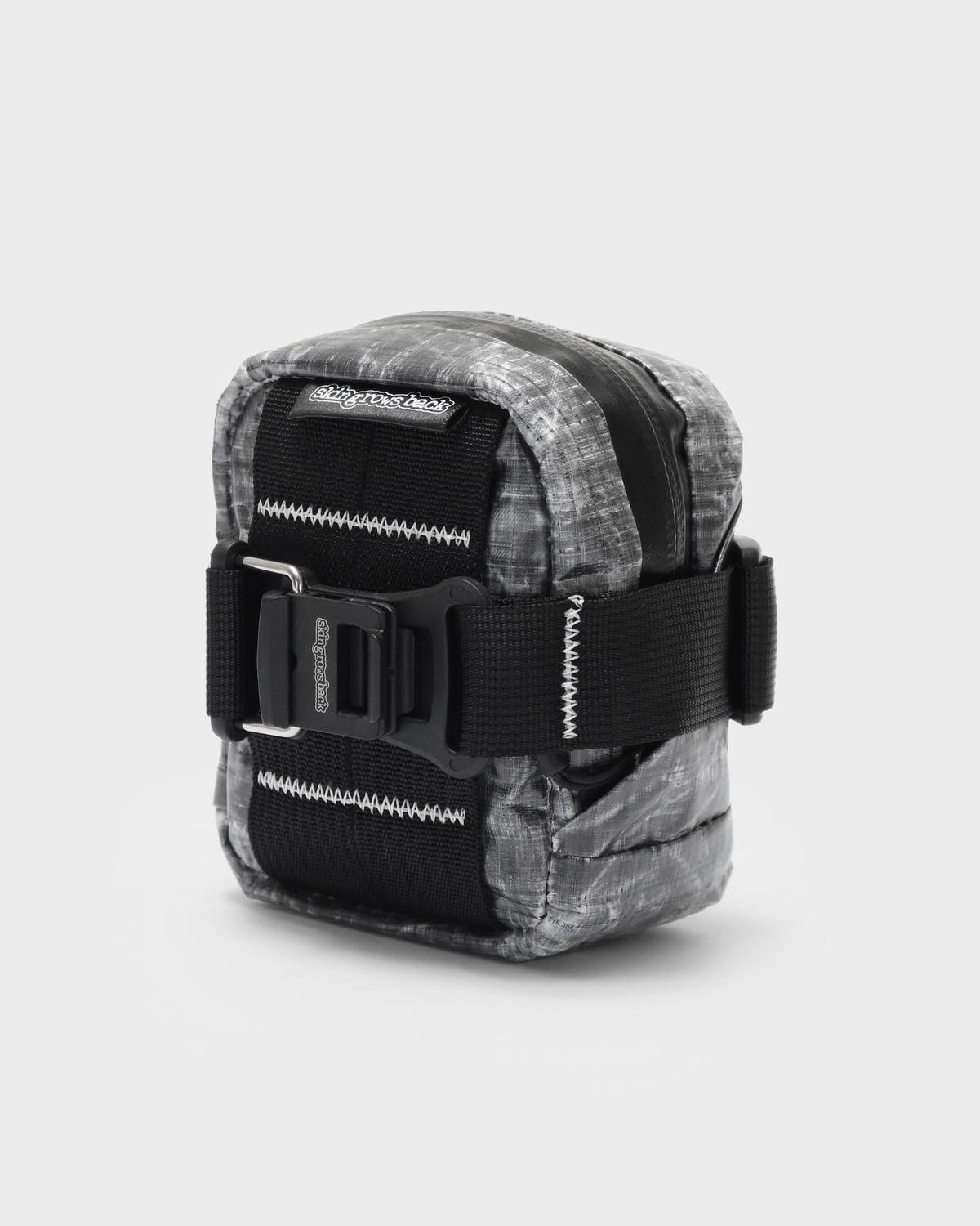 A small utility pouch with a gray and black marbled pattern, featuring black webbing straps and a black plastic buckle closure, shown on a light gray background.