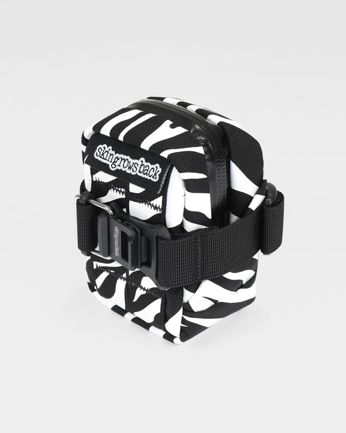 skingrowsback plan b micron saddle bag black and white zebra print with a white background