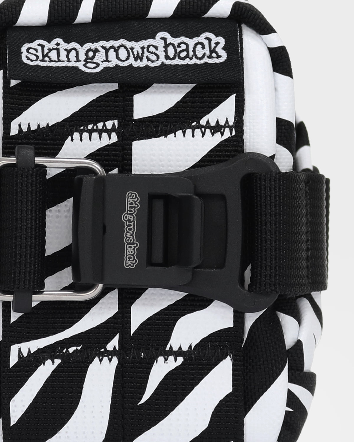 skingrowsback plan b micron saddle bag black and white zebra print with a white background