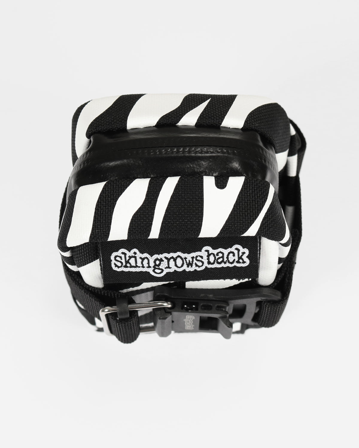 skingrowsback plan b micron saddle bag black and white zebra print with a white background