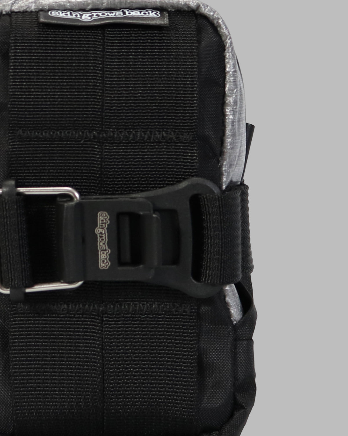 Skingrowsback plan b micron racing saddle bag black xpac vx21 plus reflective dyneema with a grey background