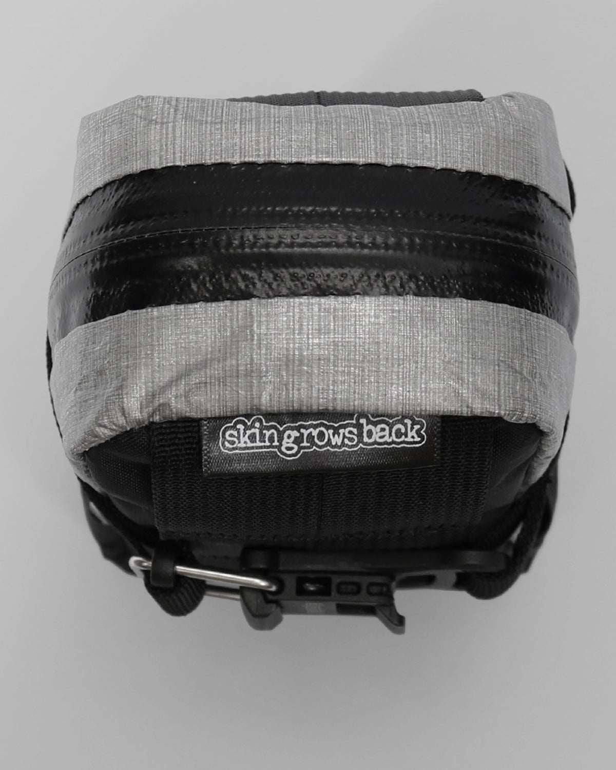 Skingrowsback plan b micron racing saddle bag black xpac vx21 plus reflective dyneema with a grey background