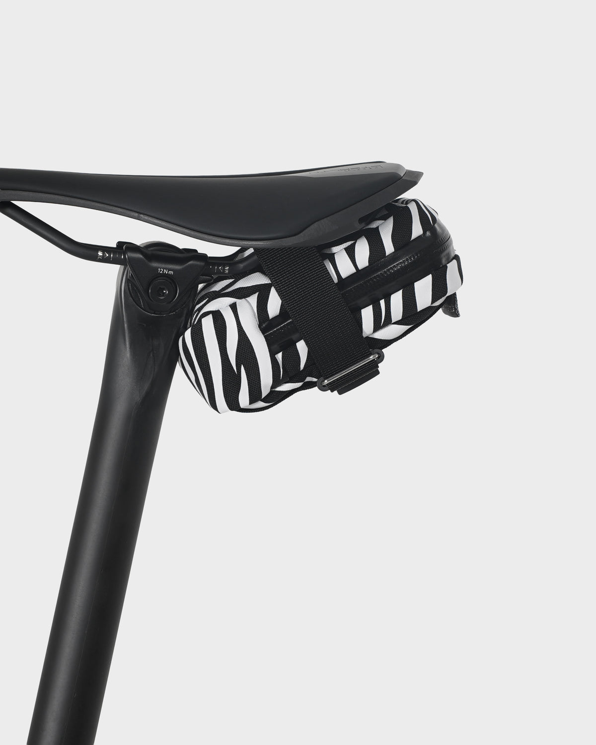 skingrowsback plan b saddle bag black and white zebra print on black saddle with a white background