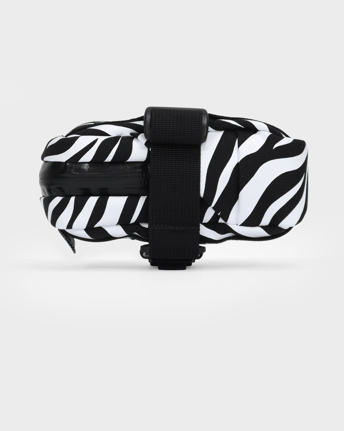 skingrowsback plan b saddle bag black and white zebra print with a white background