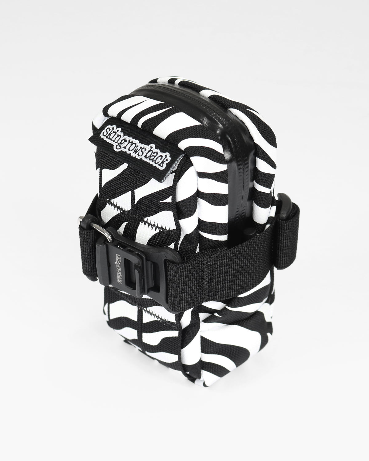 skingrowsback plan b saddle bag black and white zebra print with a white background
