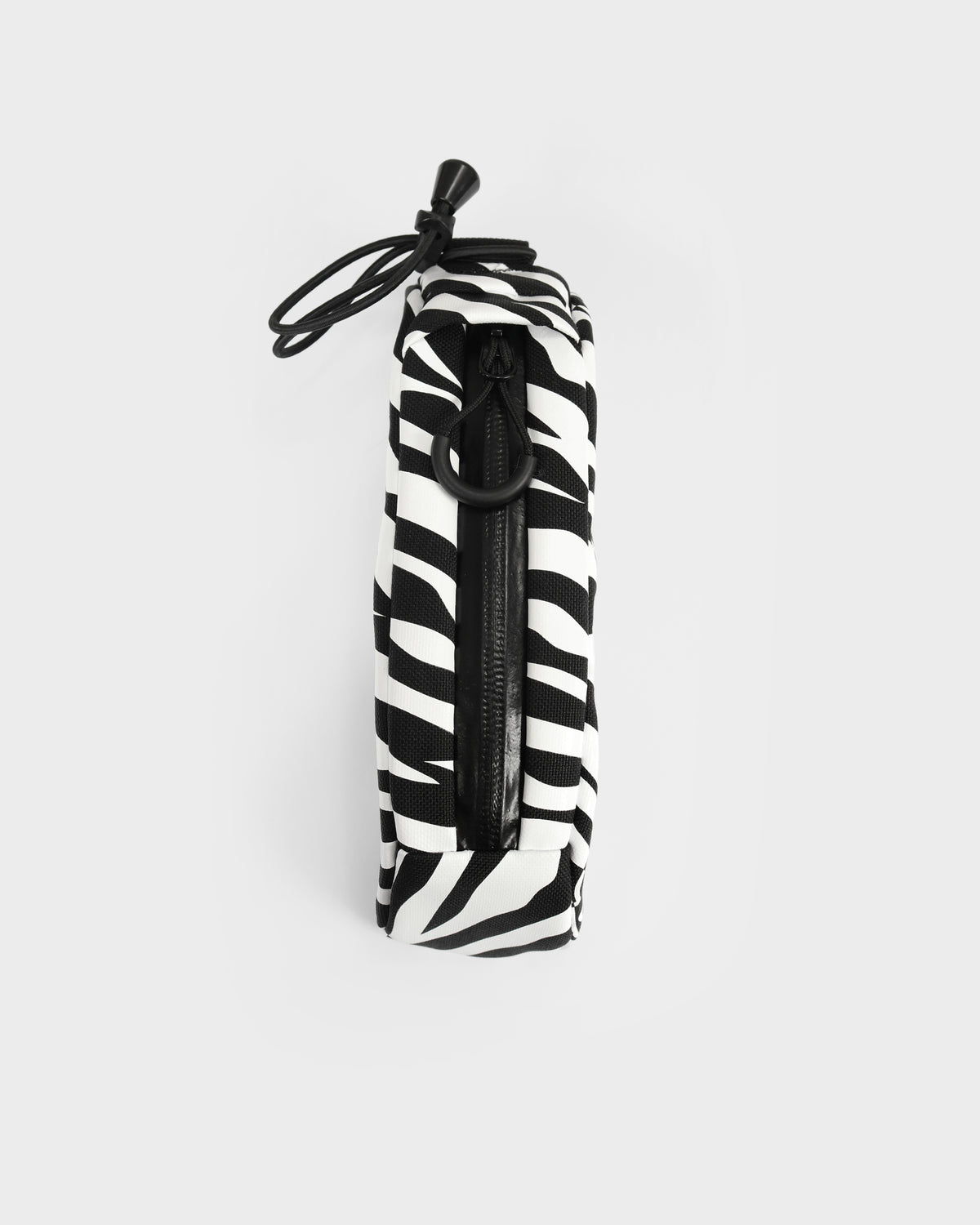 skingrowsback shortie top tube bag black and white zebra print with a white background
